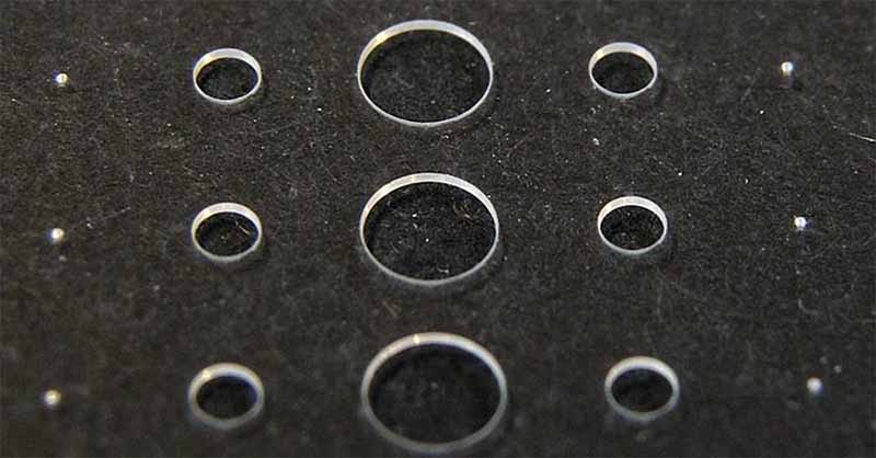 laser drilling sensitive materials
